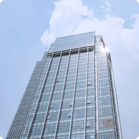 A skyscraper standing tall, under the sun light 